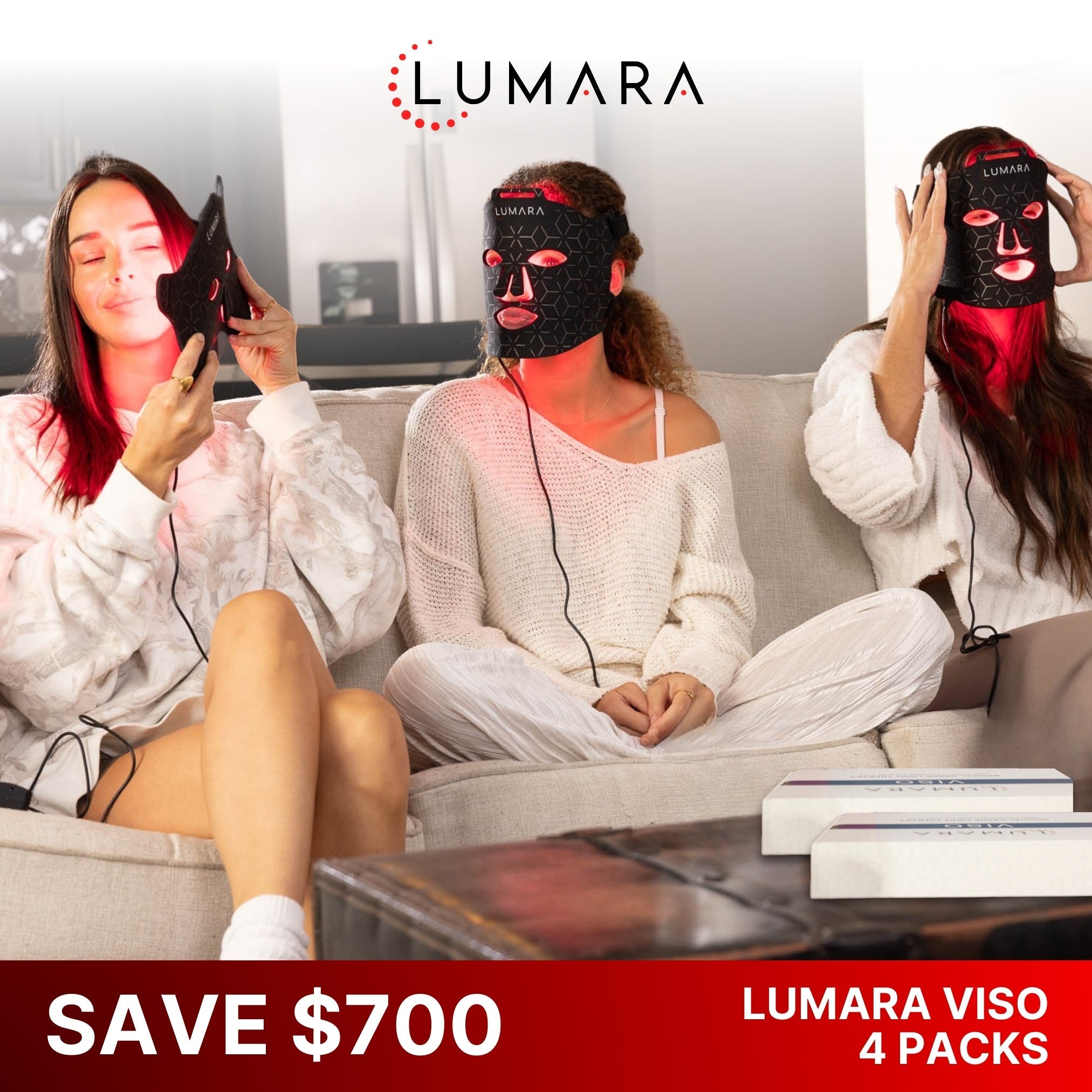 Two women wearing Lumara Viso LED face masks with a 'Save $700' four-pack offer