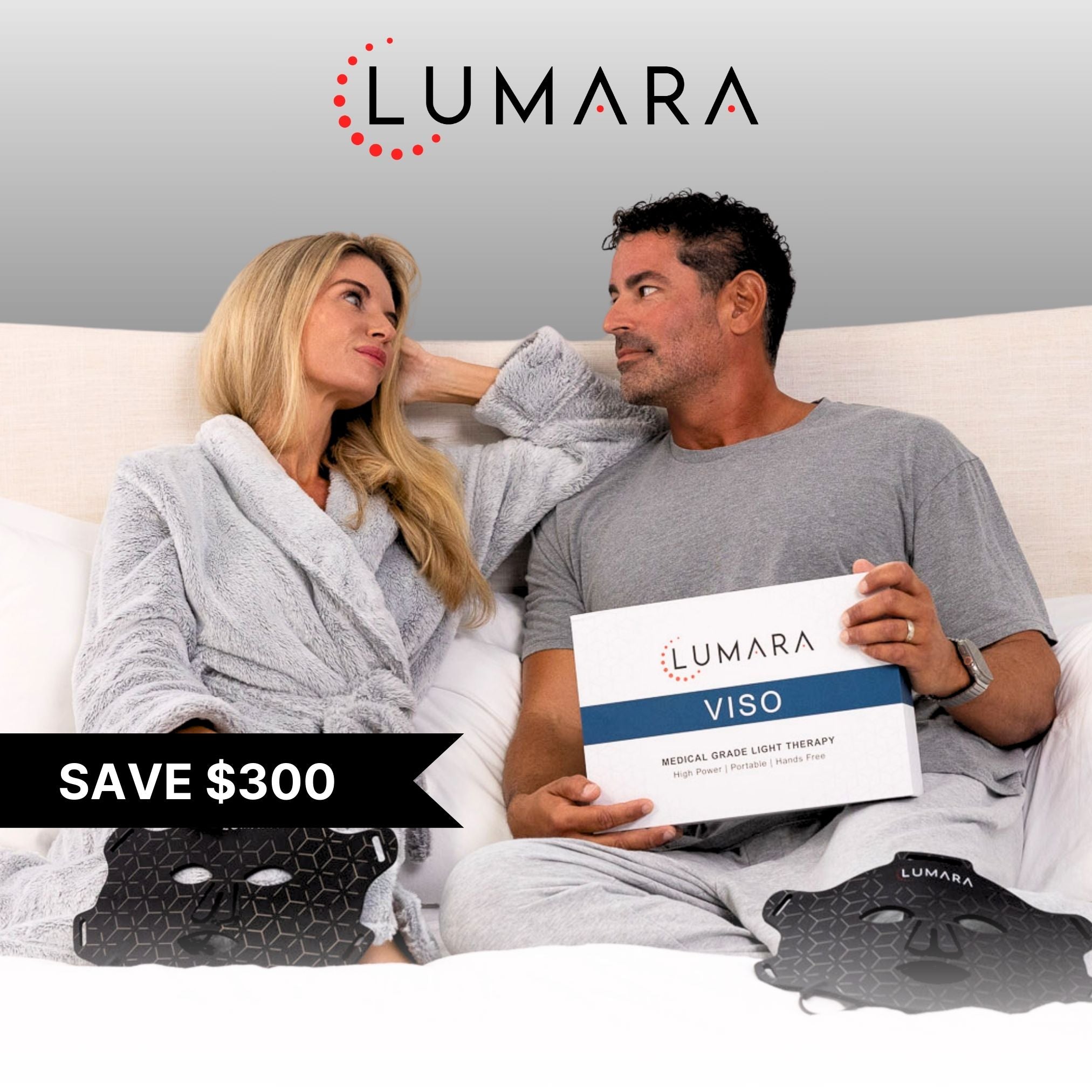 Smiling couple holding a Lumara Viso box with a 'Save $300' offer